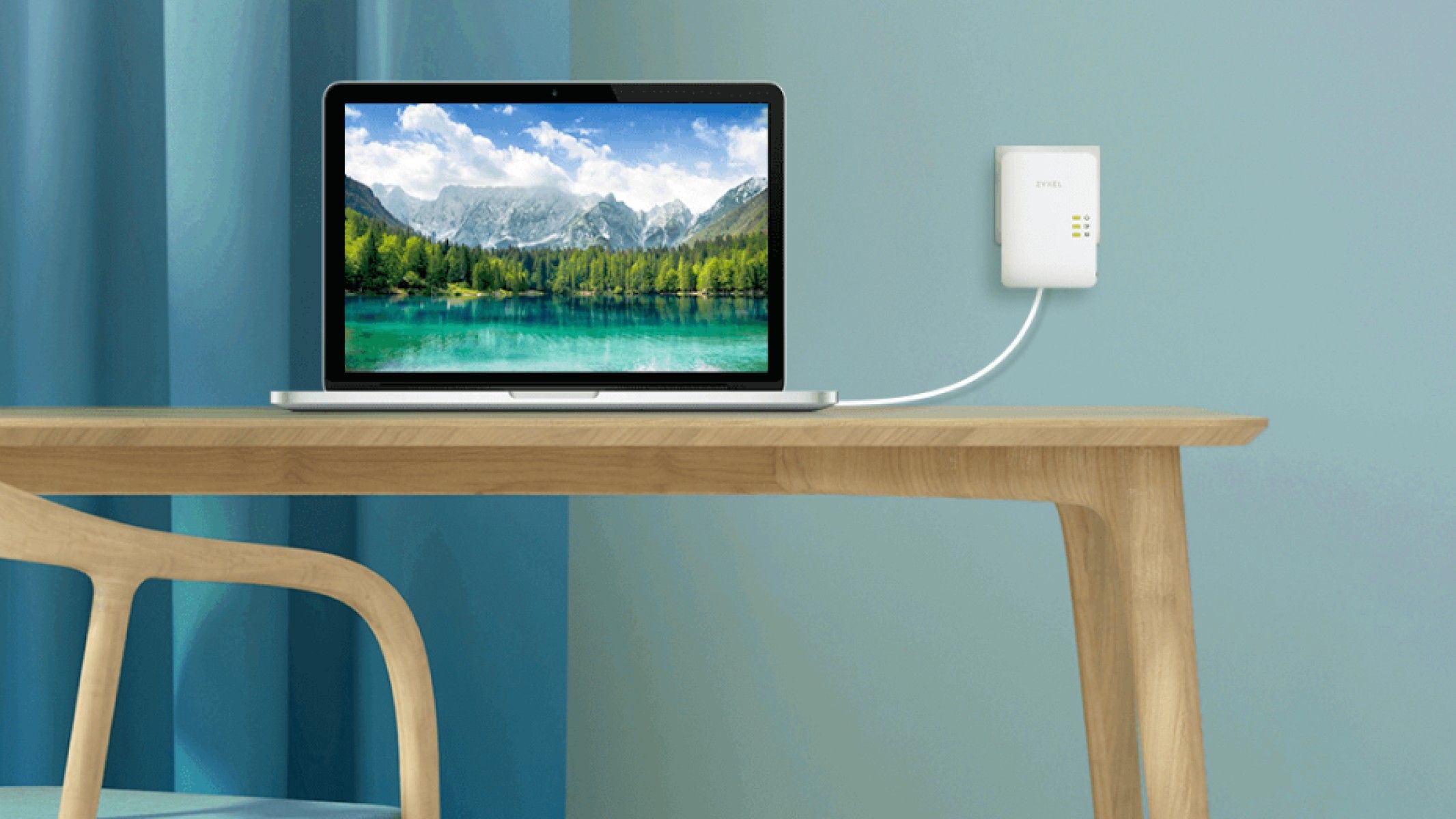 zyxel powerline adapter plugged into the wall with ethernet cable going to a laptop